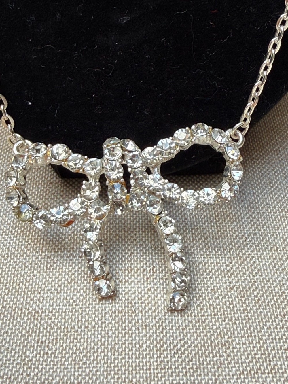 Silver Tone Rhinestone Bow Pendant Necklace